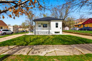 View of front of house featuring a porch and stucco siding