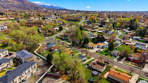 Aerial view of residential area featuring a mountain backdrop