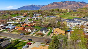 Aerial perspective of suburban area featuring a mountain backdrop