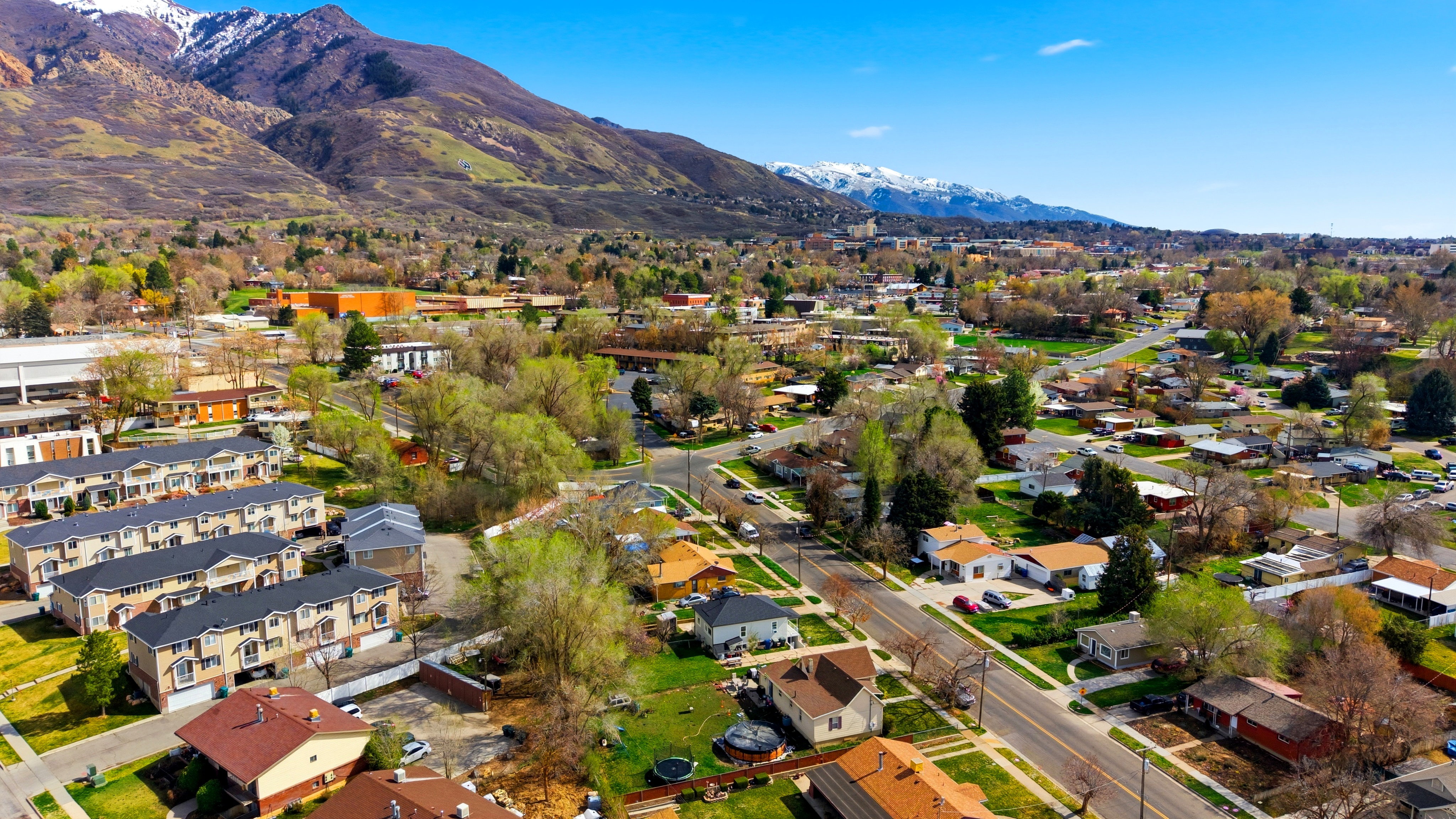 Aerial view of residential area featuring a mountainous background
