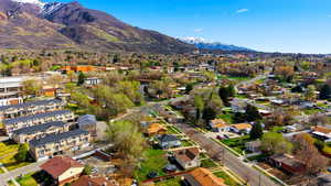 Aerial view of residential area featuring a mountainous background