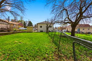 Fenced backyard with a residential view