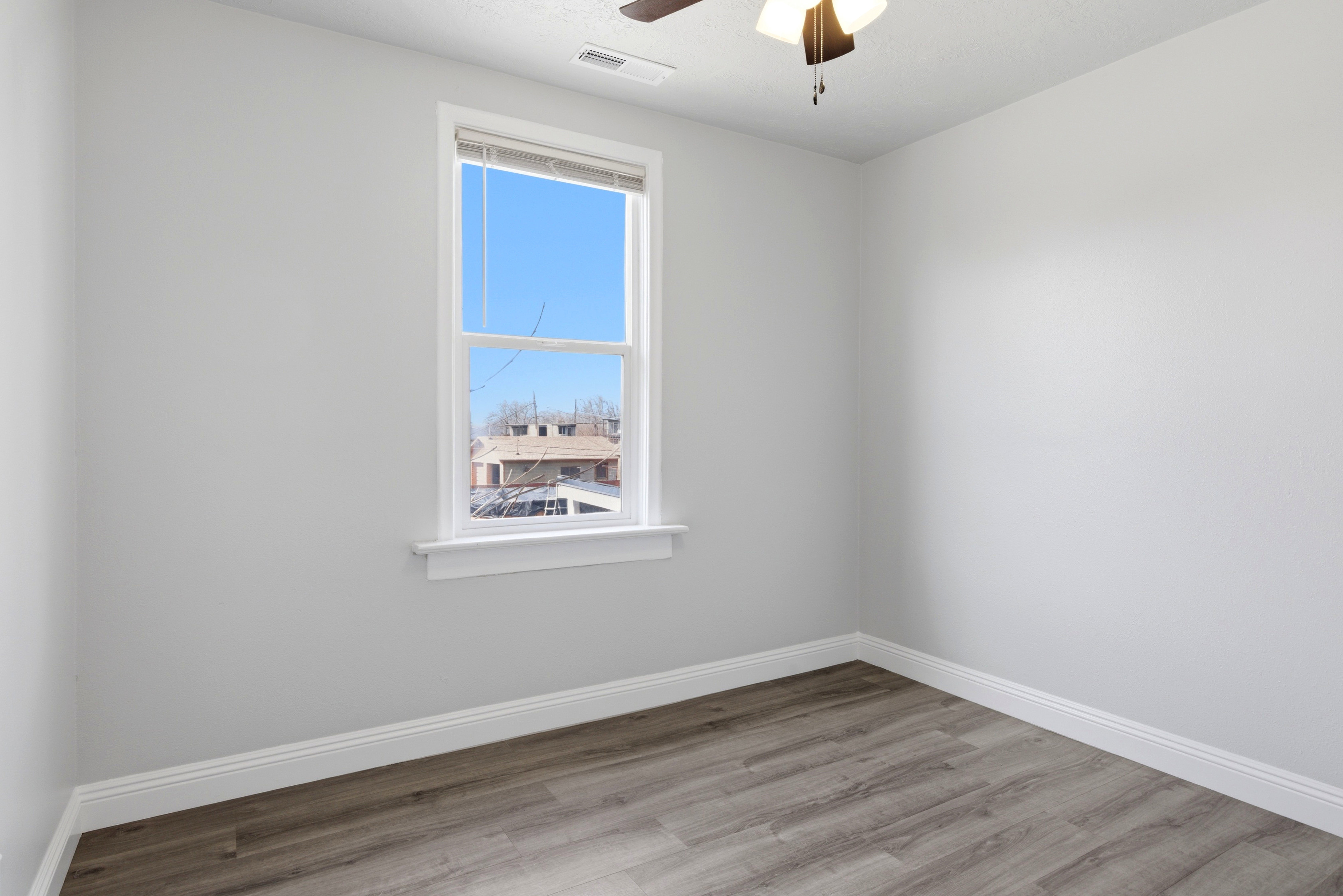 Bedroom featuring light wood-style flooring and ceiling fan