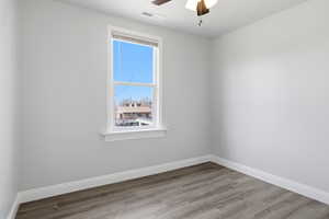Bedroom featuring light wood-style flooring and ceiling fan