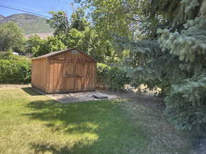 View of shed with a mountain view