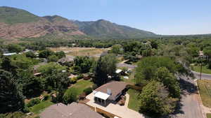 Aerial view of residential area featuring a mountain backdrop