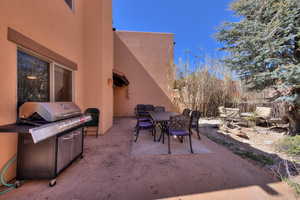 View of patio / terrace featuring outdoor dining area and a grill