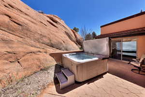 View of patio / terrace featuring a hot tub