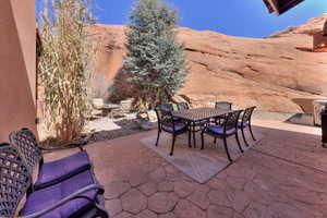 View of patio featuring outdoor dining area and a mountain view