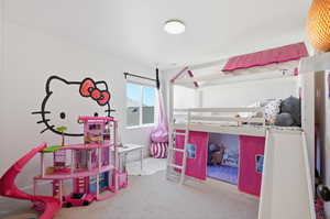 Bedroom with light carpet