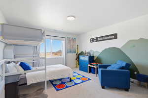 Carpeted bedroom with baseboards