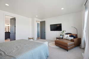 Bedroom featuring light colored carpet and recessed lighting