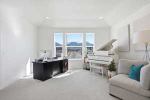 Sitting room with light colored carpet, a desk, recessed lighting, and lofted ceiling