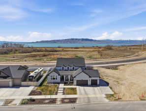 Aerial view of property and surrounding area with mountains