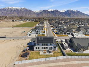Aerial perspective of suburban area featuring a mountainous background
