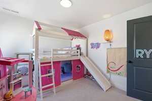 Bedroom with light carpet