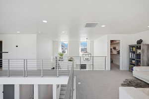 Hall with carpet and recessed lighting