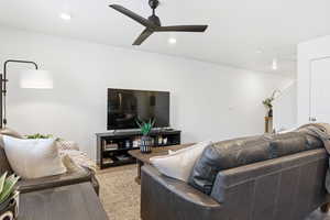 Living room with ceiling fan, recessed lighting, and wood finished floors
