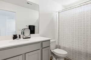 Primary Bathroom with vanity and shower / bath combination with curtain