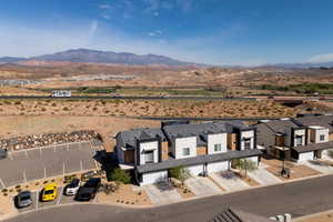 Aerial perspective of suburban area with a mountain backdrop