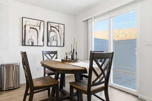 Dining area with light wood finished floors