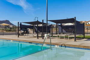 Community pool featuring a patio area