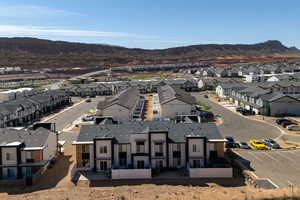 Aerial perspective of suburban area featuring a mountain backdrop