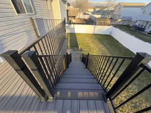 Brand New TREX Stairs with Wrought Iron Railing to your large backyard
