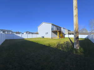 Fully fenced backyard featuring a Brand New TREX deck with stairs to your backyard