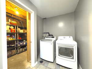 Laundry area with washer and clothes dryer and food storage room. This food storage room can be converted to a 3rd Bathroom