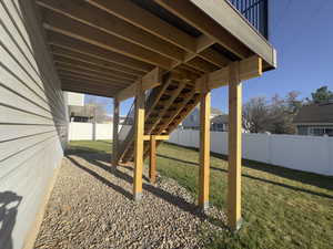 View of solid construction of new TREX Deck surrounded by fully fenced backyard