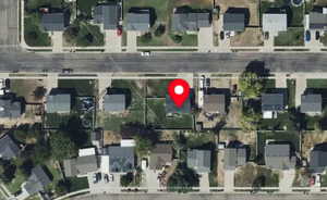 Aerial overview of property's location featuring nearby suburban area