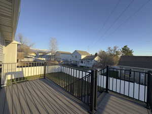 Spacious Brand New TREX Deck, Wrought Iron Railing, featuring a residential view