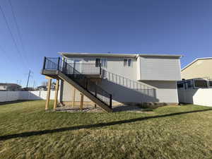 Back of house featuring a with a Brand New TREX deck and stairs