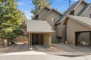 View of front of property with roof with shingles