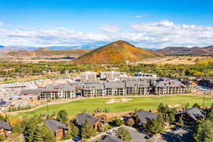 Bird's eye view of a mountain backdrop and a golf club