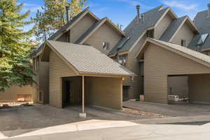 View of front facade with roof with shingles