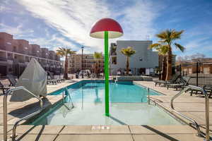 Community pool with a patio area
