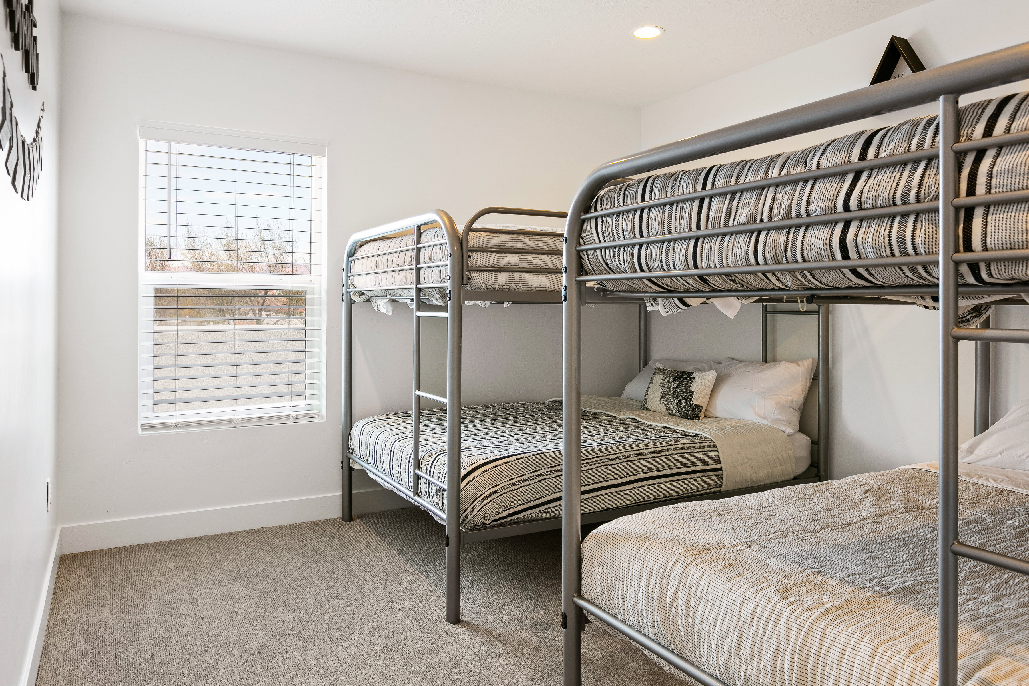 Bedroom featuring light colored carpet and recessed lighting