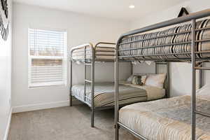 Bedroom featuring light colored carpet and recessed lighting