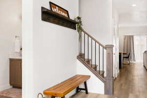 Stairs featuring baseboards and wood finished floors