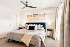 Carpeted bedroom with a closet, a ceiling fan, and recessed lighting