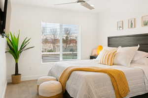 Bedroom featuring carpet and ceiling fan