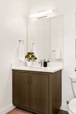 Bathroom featuring toilet and vanity