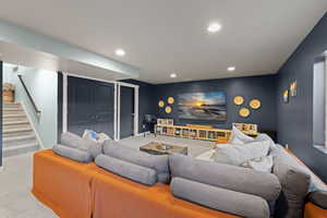 Living area featuring carpet floors and recessed lighting