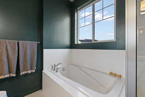 Full bathroom with a garden tub