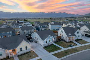 Aerial view of residential area featuring a mountainous background