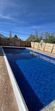 View of pool featuring a fenced backyard