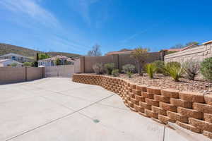 Fenced backyard featuring a residential view