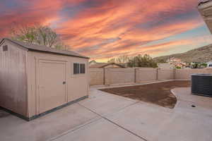 View of shed featuring a fenced backyard